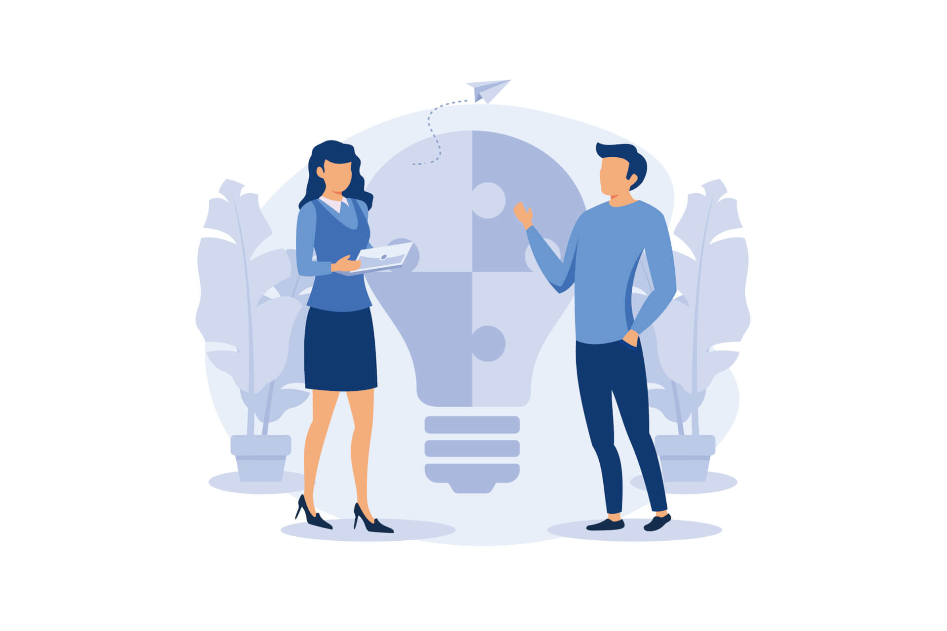Man and woman standing next to each other, talking, a giant light bulb in the background.
